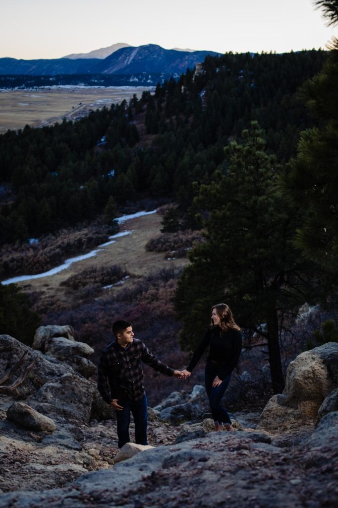 engaged couple pose for mountain engagement photographer