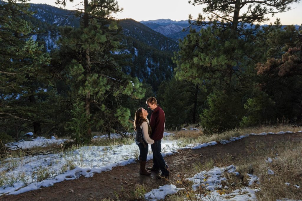 couple in front of rocky mountains at Chautauqua park