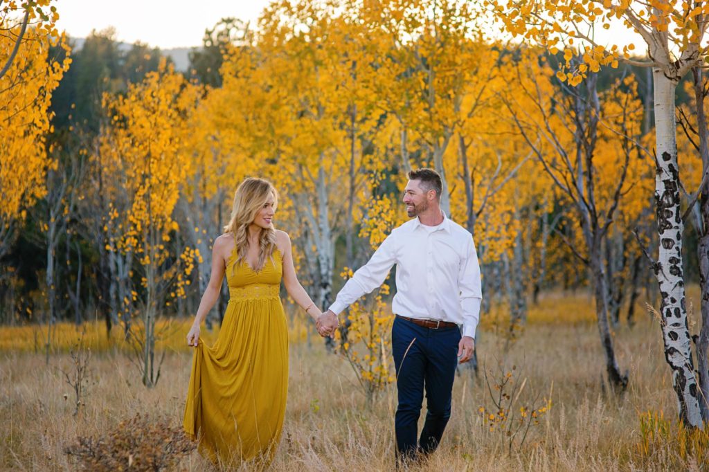 Colorado couple in front of aspen trees