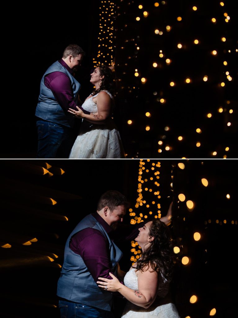 newlywed couple in front of christmas lights