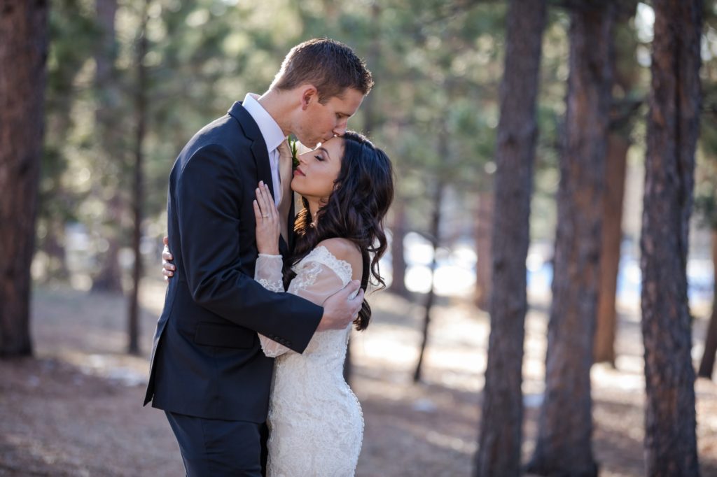 bride and groom at woodsy Colorado wedding