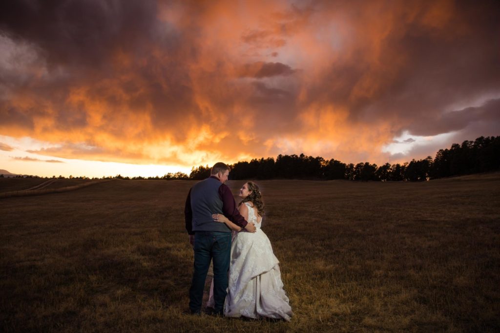 Colorado Springs couple in front of epic sunset
