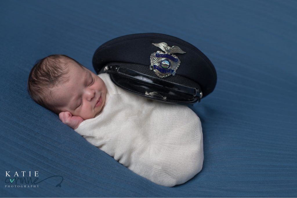 cop themed watch your baby grow newborn session
