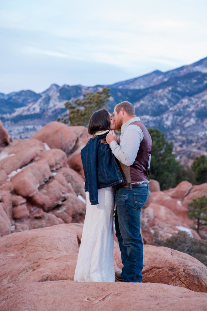 bride and groom kissing at garden of the gods elopement
