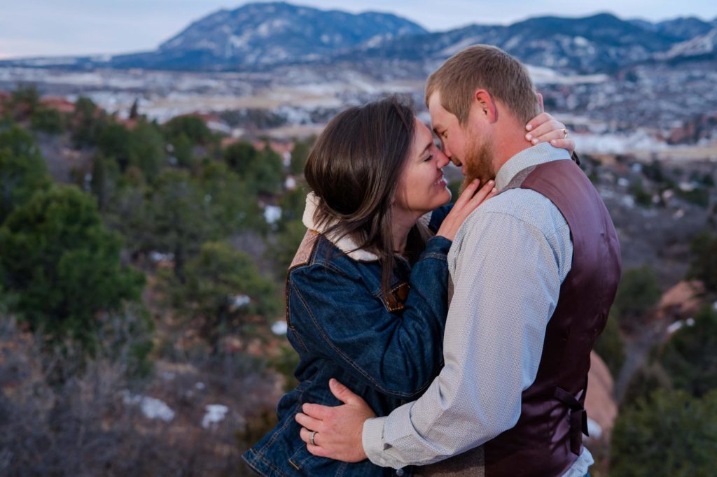 bride in denim jacket with country groom at garden of the gods