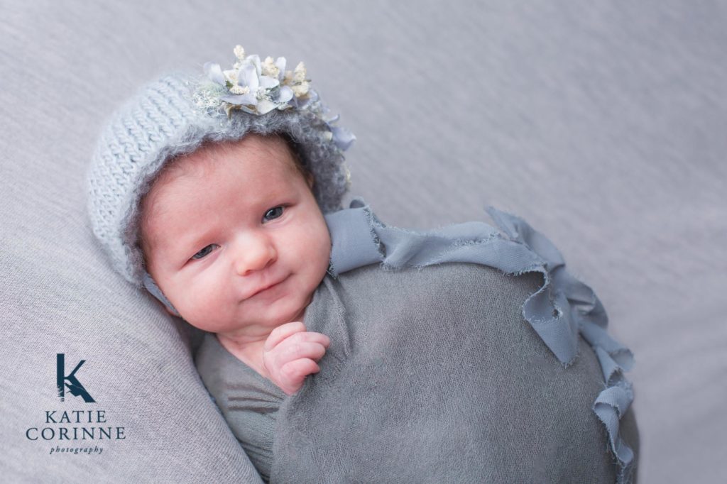 Baby smiles for Black forest newborn photographer
