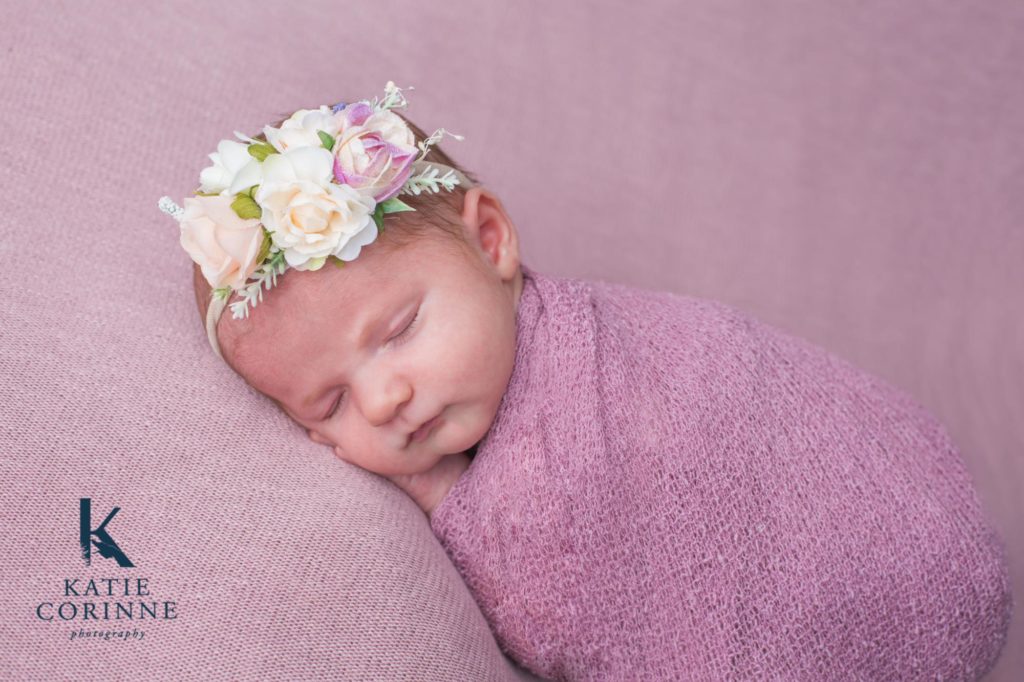 baby girl wears flower headband