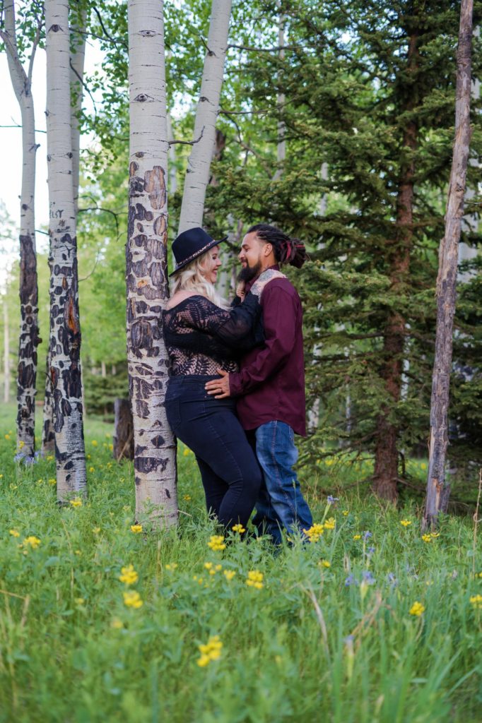 colorado couple in mountain wildflower field
