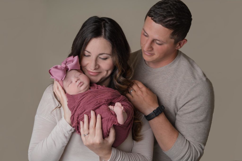 Colorado parents hold newborn baby