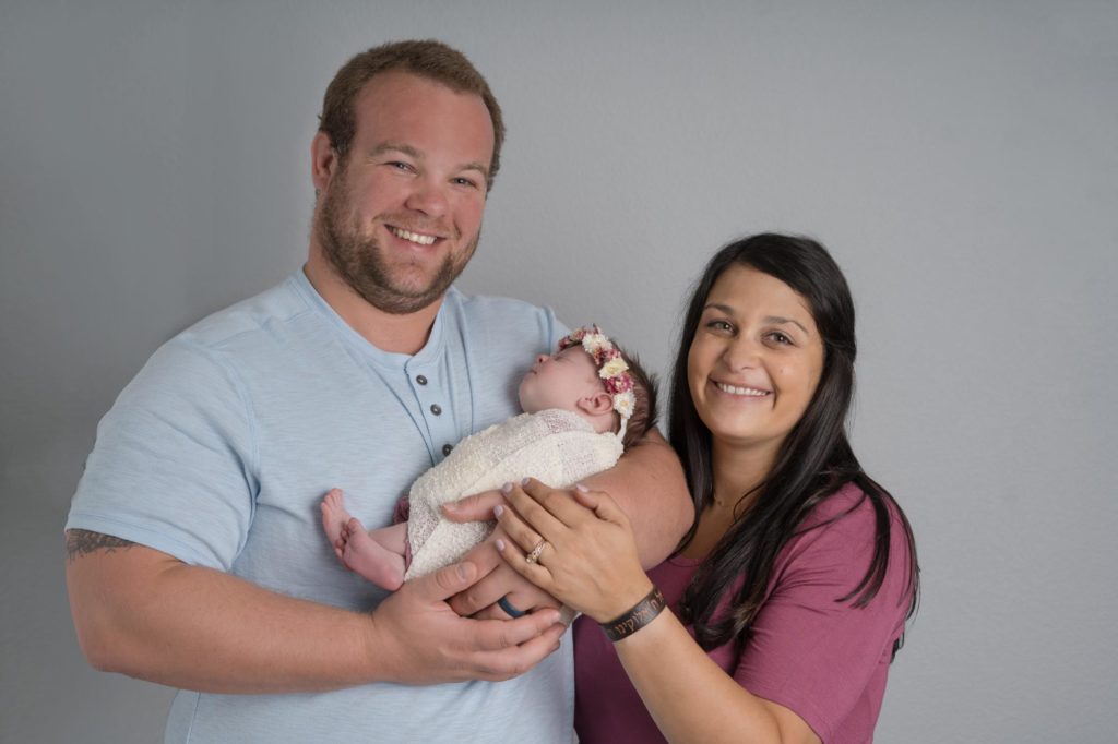 Colorado Springs parents hold newborn baby girl