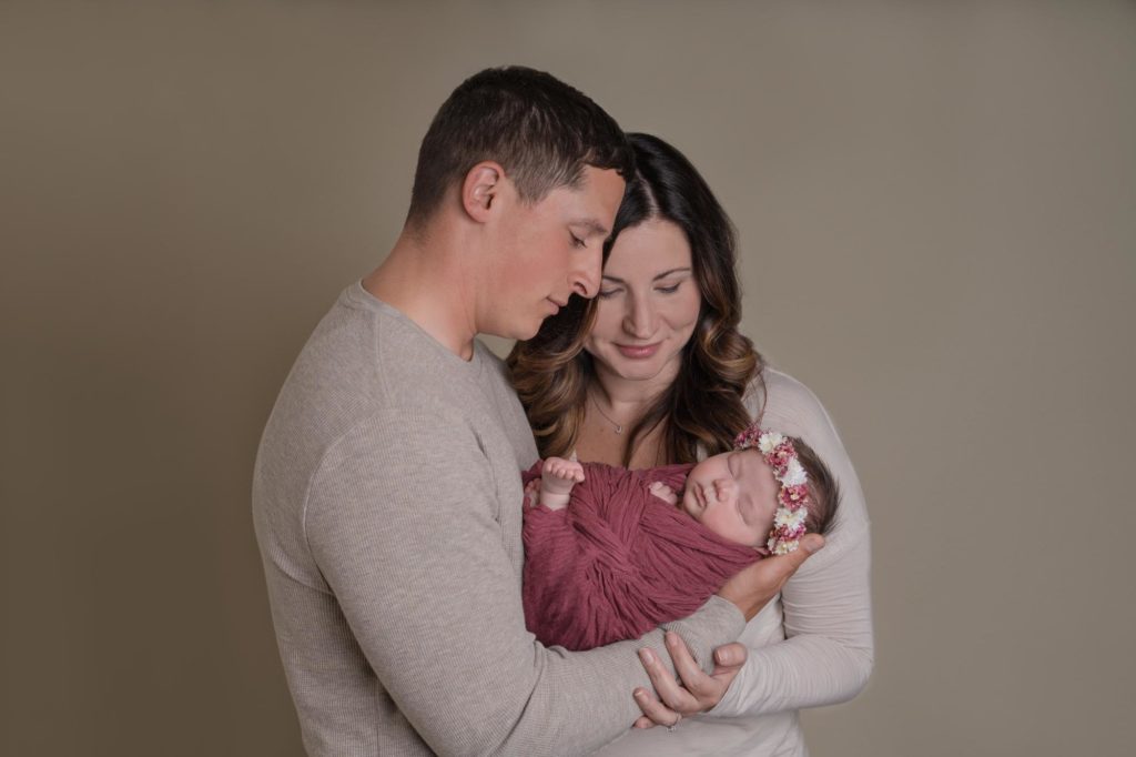 Colorado Springs parents hold newborn baby