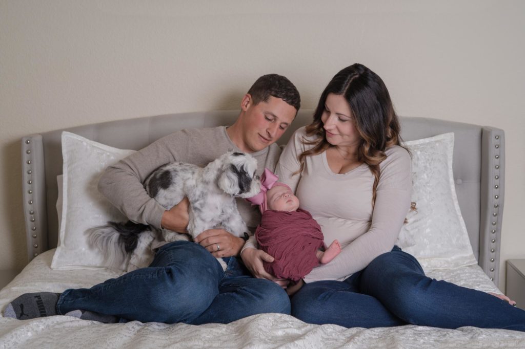Colorado Springs Military family holds newborn baby and pup