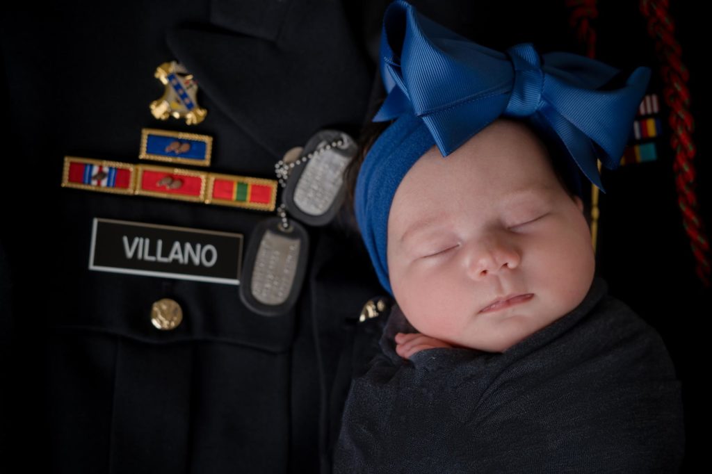Colorado Springs newborn on military uniform