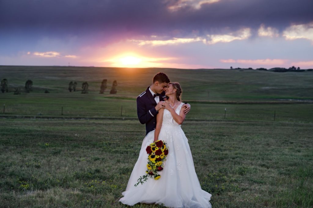 military wedding couple in Larkspur with sunflower bouquet