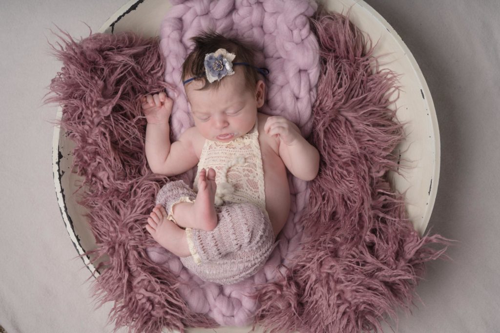 Colorado Springs baby girl posed for newborn photographer