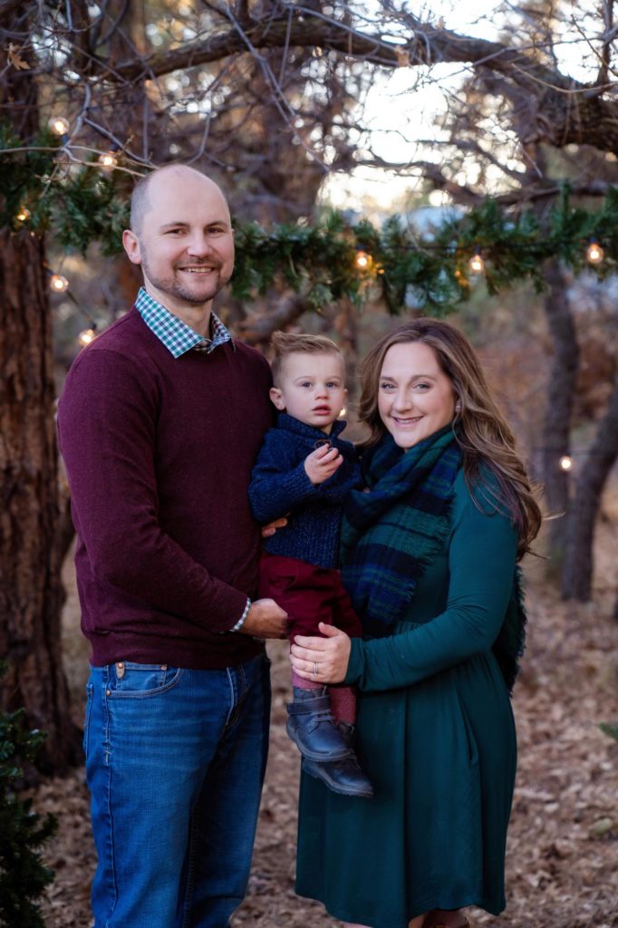 family poses for holiday card photo