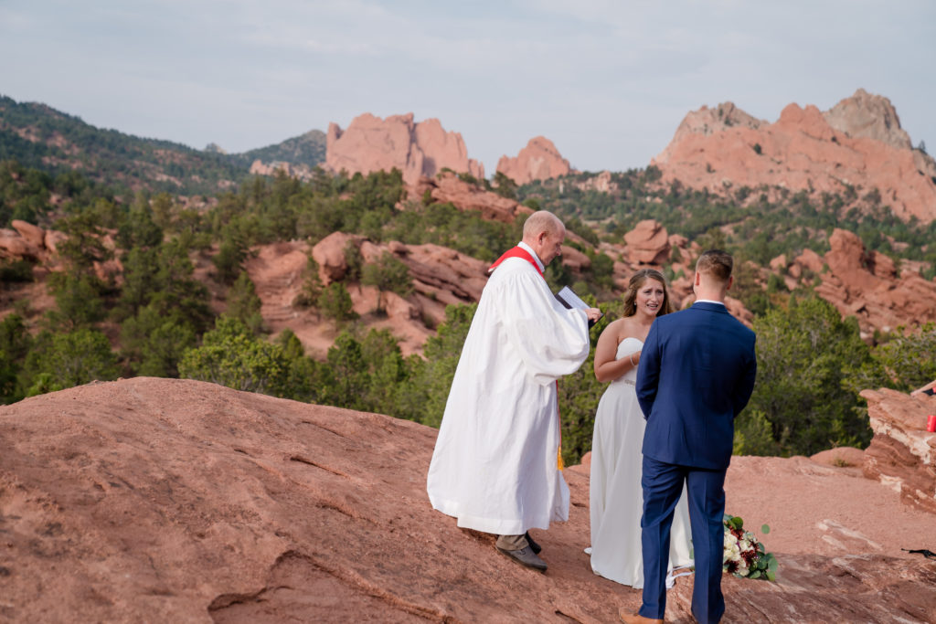 bride recites vows at Garden of the Gods