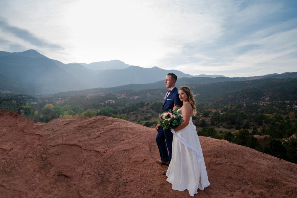 Newlyweds in front of Rocky Mountains