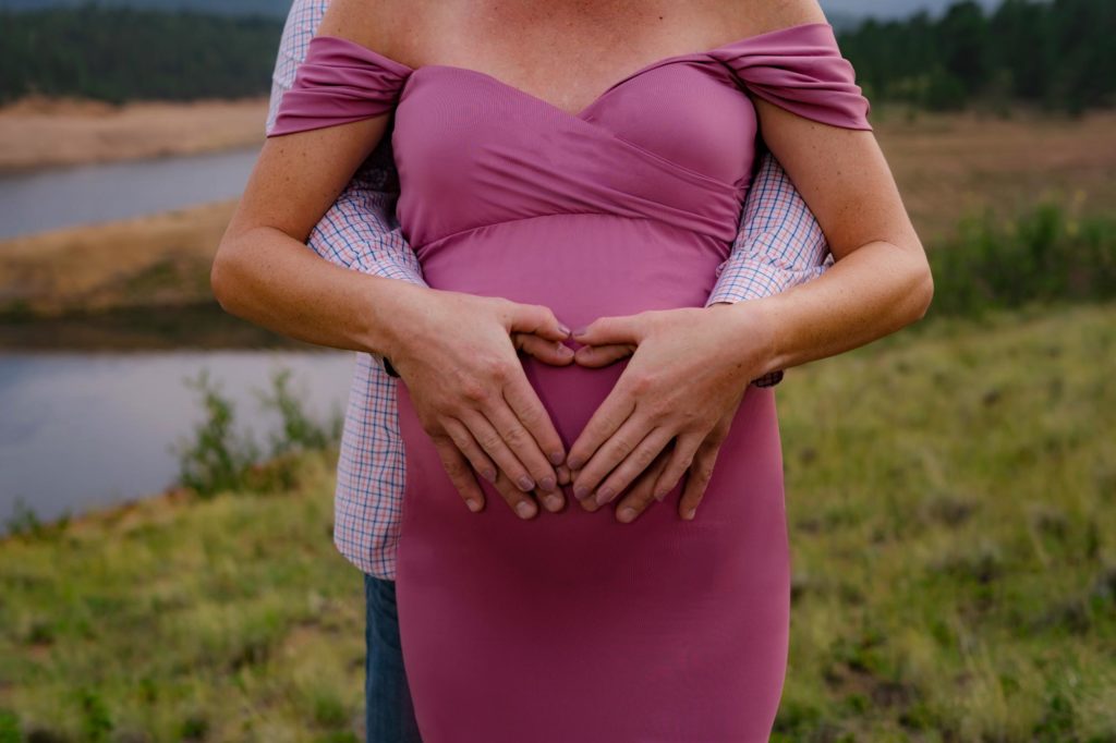 Colorado Springs couple poses for maternity photographer