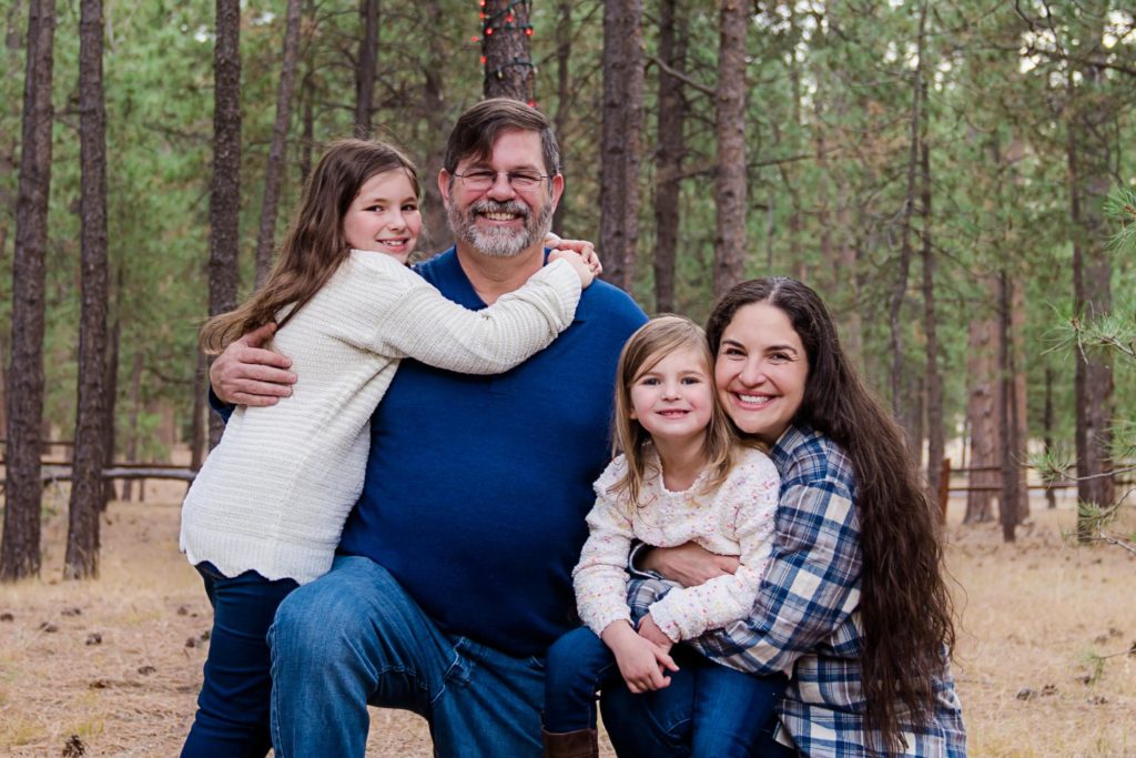 Colorado parents hug two daughters