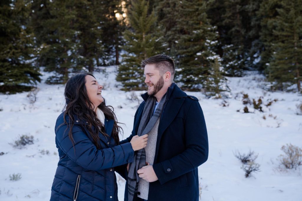 Colorado couple play during winter engagement photo session