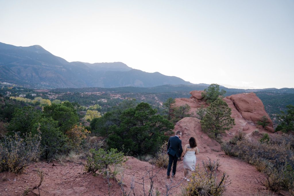 couple looks at Rocky Mountains on 2021 popular wedding date