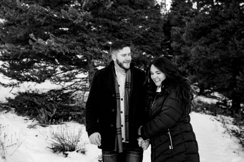 black and white photo of engaged couple in the winter