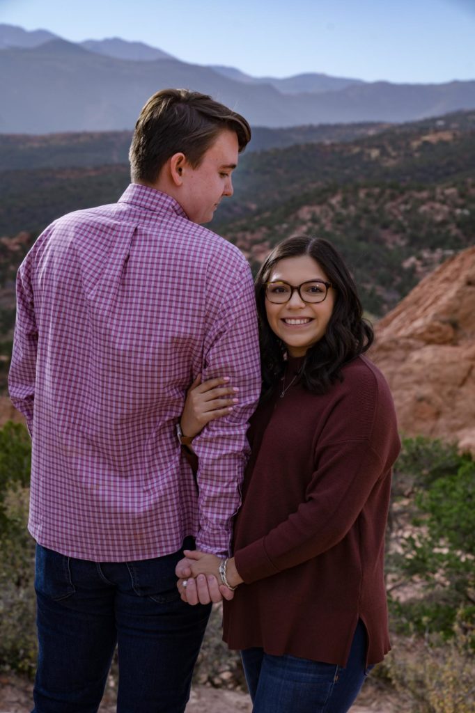 pregnant couple celebrates engagement at Garden of the Gods
