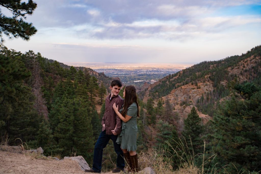 engaged couple on mountain overlook