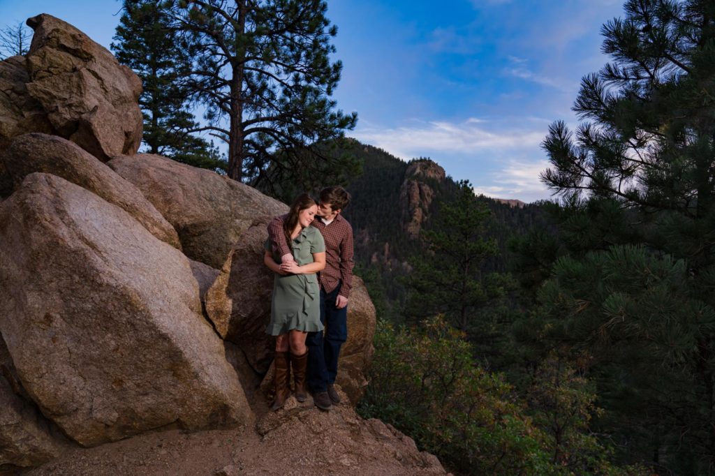 Colorado couple kiss on mountaintop