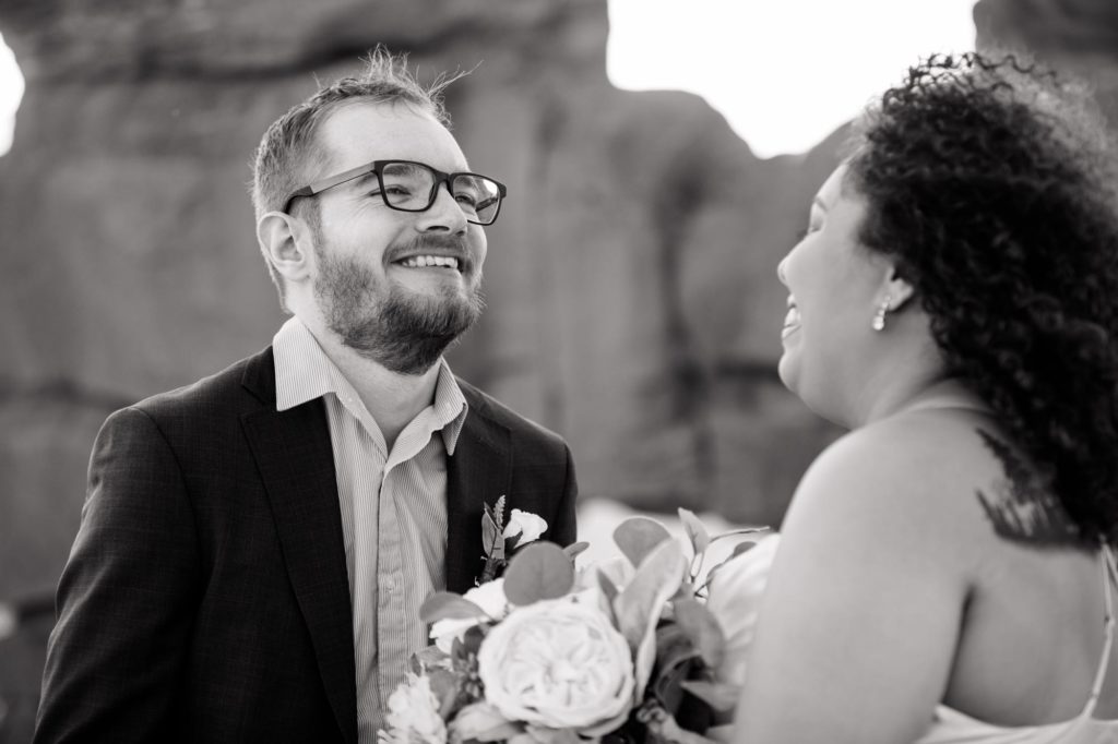 groom reads vows at Garden of the Gods