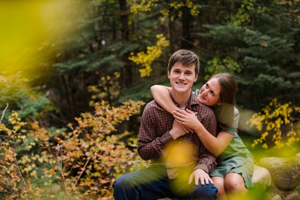 Colorado Springs couple embrace in the woods