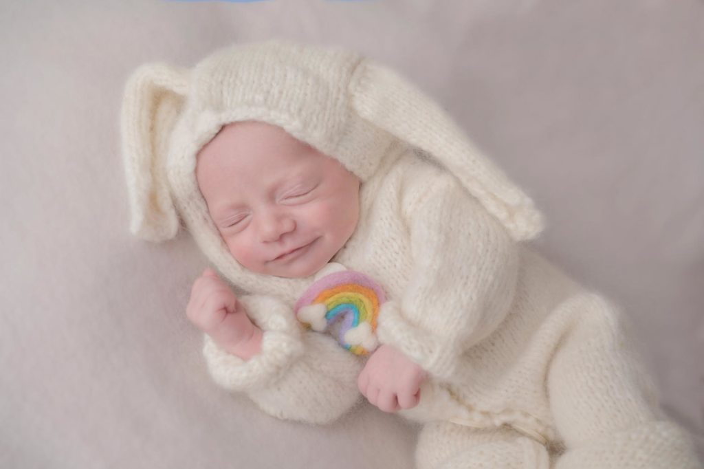 baby smiles in best colorado springs newborn photography studio