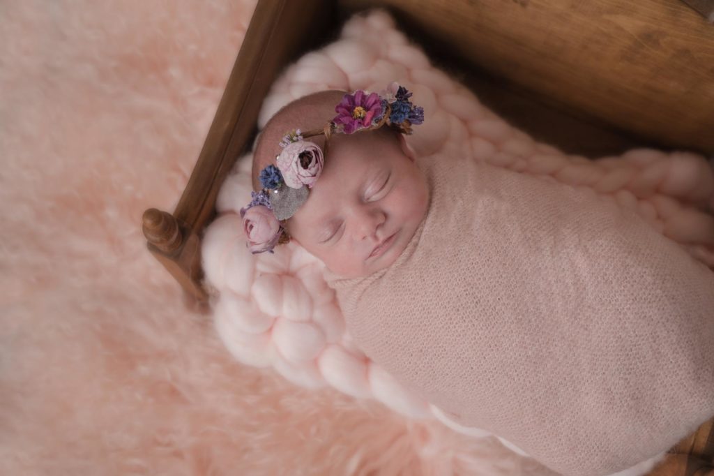 baby girl wearing flower crown