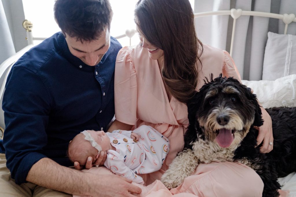 Colorado parents introducing pet to newborn