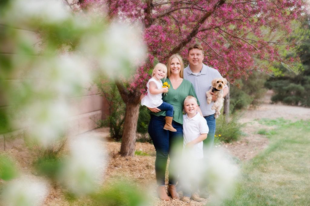 Colorado family in the springtime with flowering trees