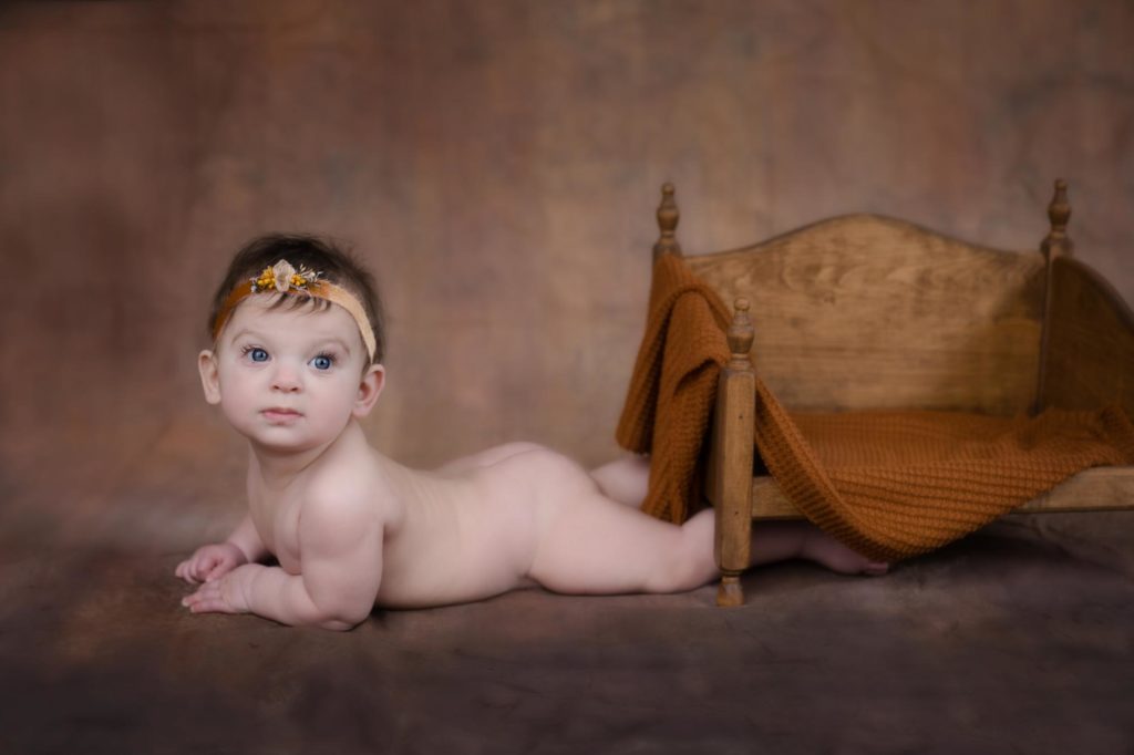 six month old poses at colorado milestone sessions