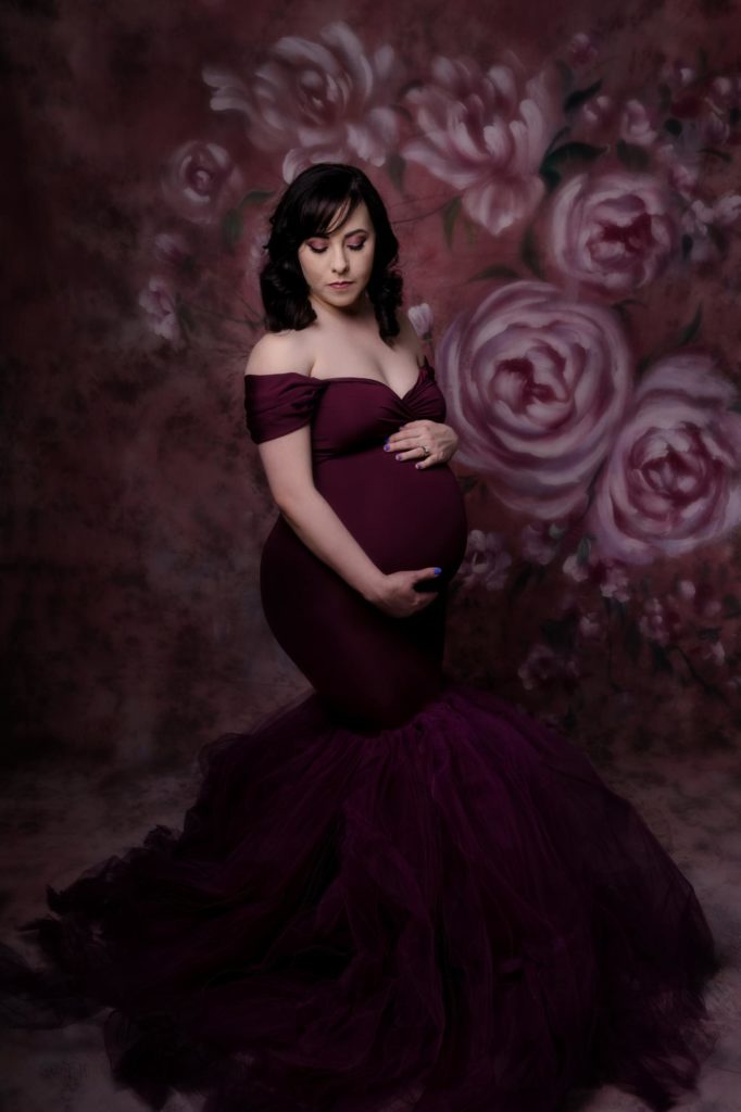 woman poses forColorado Springs studio maternity portraits