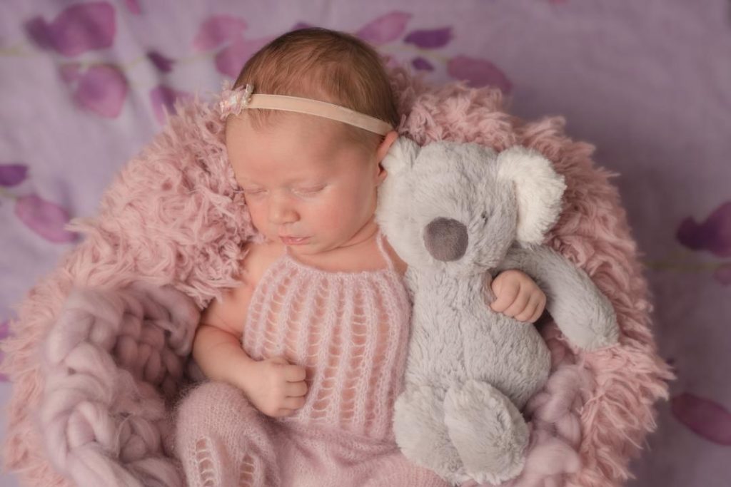 baby girl with koala stuffie
