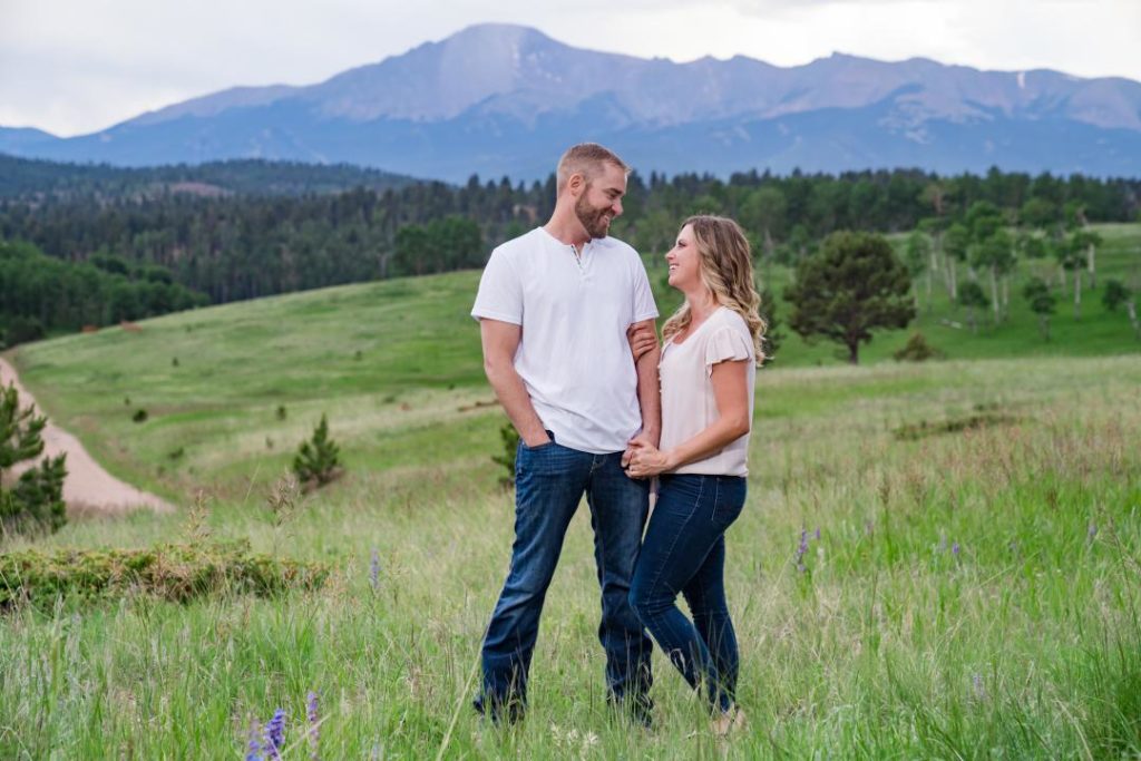 Colorado couple in front of rocky mountains