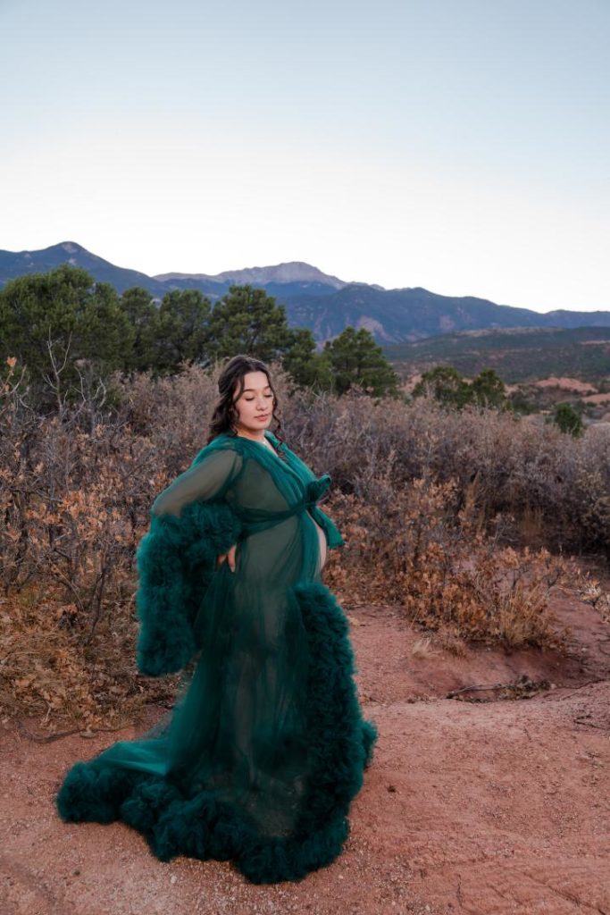 Pregnancy photos in green couture dress