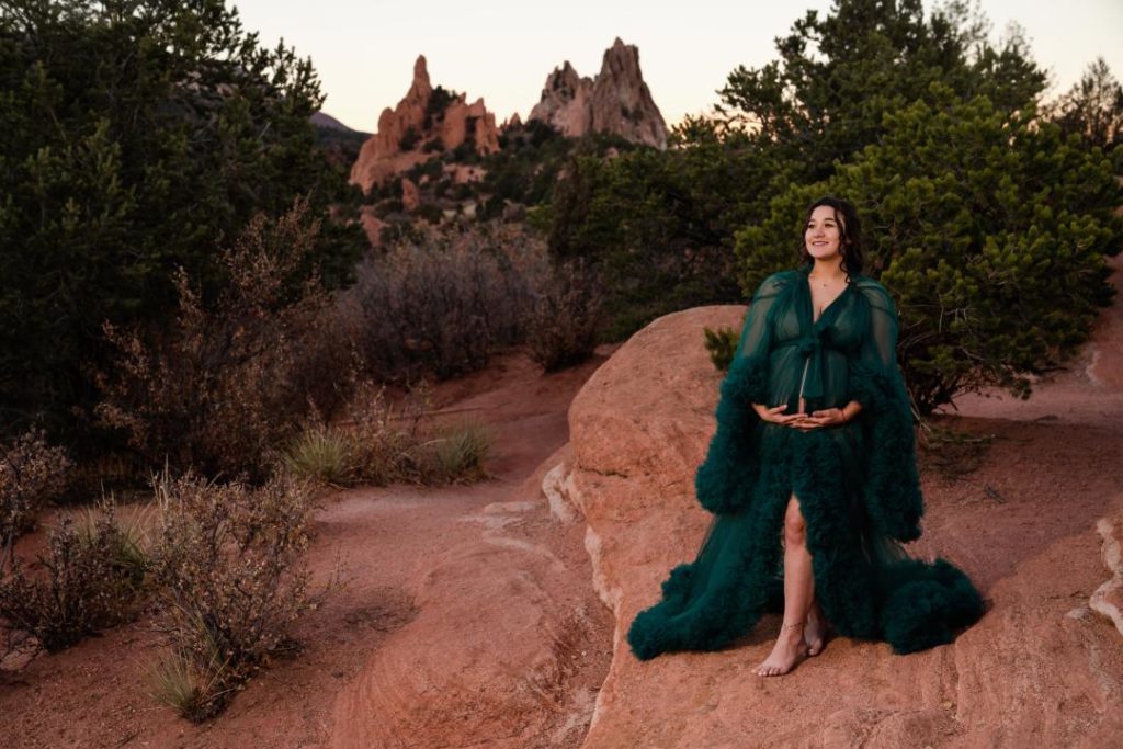 maternity photos in green couture dress