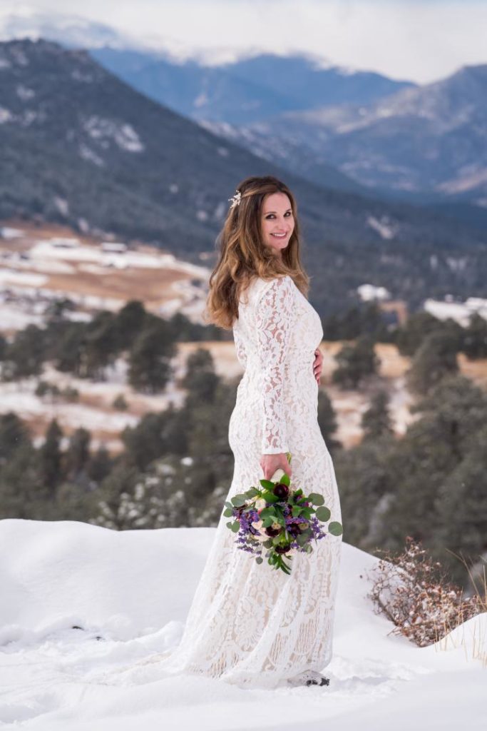 bride with snow capped mountains of Colorado